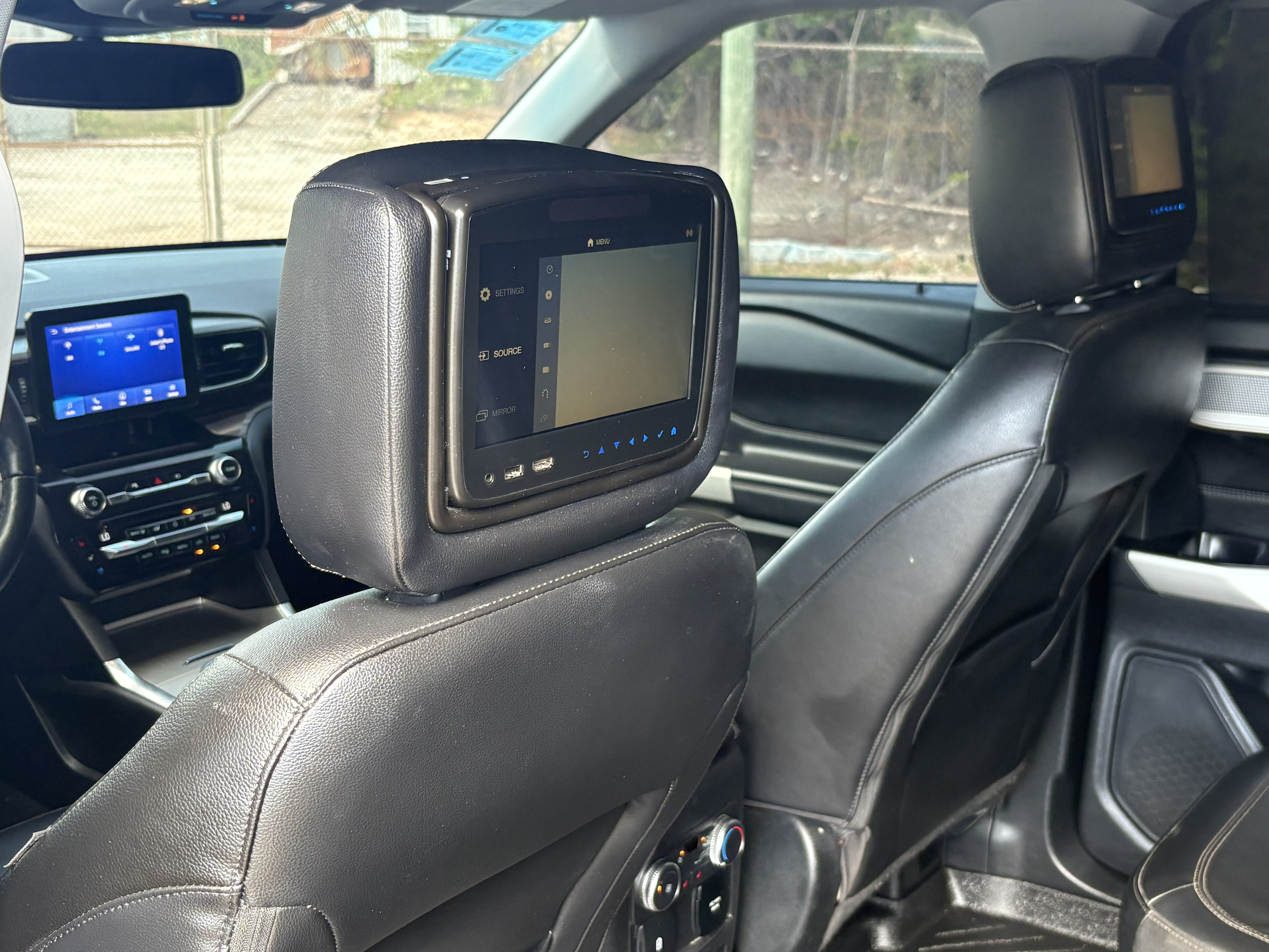 Rear headrest entertainment TV